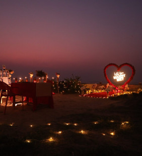 Proposal Setup on beach with Red Rose Heart Backdrop